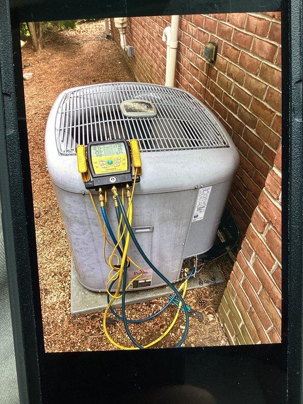 Completed scheduled cooling system maintenance visit as part of membership agreement. Performed comprehensive diagnostic testing of outdoor condenser unit using refrigerant manifold and micron gauge, measuring system pressures, temperatures, and operational parameters to verify proper cooling performance. All readings confirmed system operating within manufacturer specifications.