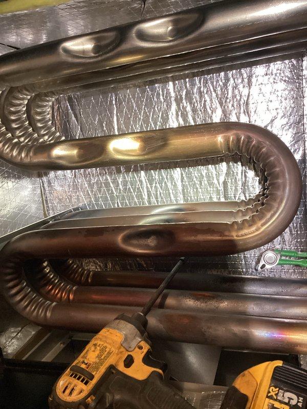Completed comprehensive tune-up on MagicPak HVAC unit, inspecting heat exchanger coils, electrical connections, and condensate drainage system. Discussed smart thermostat upgrade options with customer to improve system efficiency and control. Unit operating properly with all components inspected and verified functional.