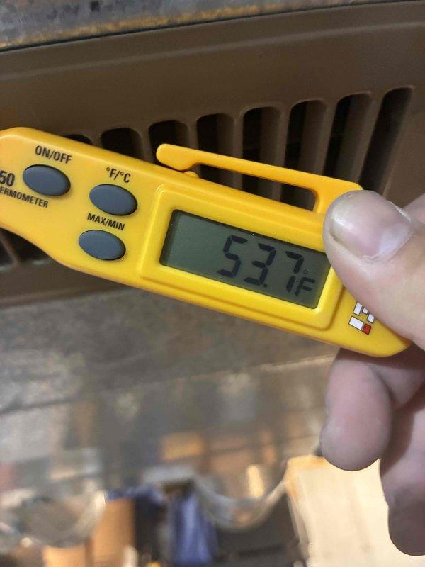 Completed comprehensive air conditioning tune-up and system diagnostics. Performed electrical testing using digital multimeter, recording capacitor readings of -46.89 MFD on system components, and measured operating temperature of 537°F at heat exchanger assembly. Inspected all electrical connections, control panel wiring, and HVAC equipment components to ensure proper system operation and performance.