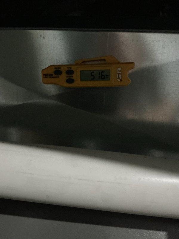 Completed preventative maintenance tune-up on residential air conditioning system. Performed comprehensive inspection of outdoor condenser unit including fan assembly and motor operation, verified proper airflow through protective grill, and measured system temperatures using calibrated digital thermometer, recording supply air temperature of 57.6°F at ductwork. All components found operating within normal parameters with unit showing good overall condition and no visible signs of wear or deterioration.
