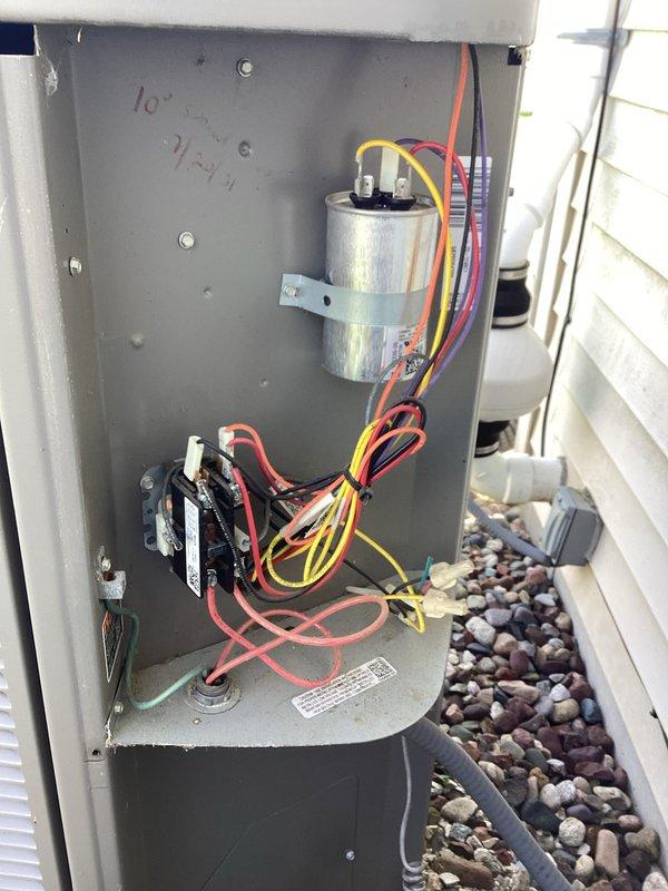 Completed comprehensive tune-up service on residential air conditioning system. Inspected outdoor unit electrical components including capacitor, contactor, and all associated wiring connections, which were found to be in good working condition with no signs of corrosion or damage. Evaluated evaporator coil fins, noting moderate dust and debris accumulation between fins that could impact heat transfer efficiency if not addressed during future maintenance.