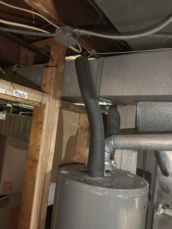 Conducted on-site assessment of existing plumbing infrastructure in unfinished basement area for piping replacement estimate. Inspected exposed utility systems including PVC piping, water heater connections, and associated mechanical installations running through ceiling joists and wall cavities. Evaluated condition of existing pipe runs, support brackets, and insulation materials to determine scope of replacement work required. Documented current configuration of supply lines, drain lines, and flexible conduits for comprehensive piping replacement proposal.