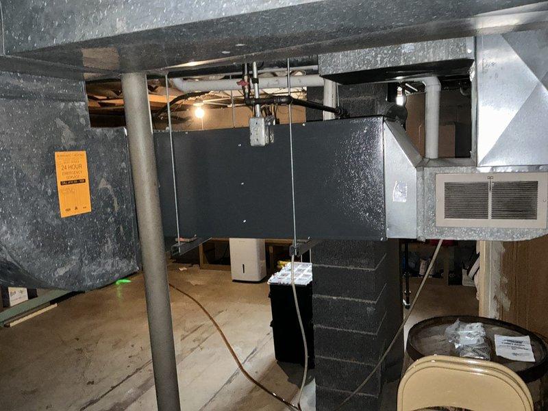 Completed furnace replacement estimate for residential heating system with safety lockout preventing heat operation while air conditioning remains functional. Assessed existing HVAC equipment in basement utility area, documented current thermostat configuration and furnace condition, and provided replacement options to restore safe heating capability to the home.