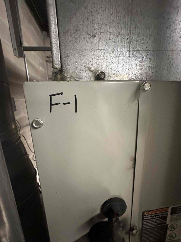 Conducted site assessment for replacement of two commercial air conditioning units. Inspected existing HVAC infrastructure in mechanical room, documented current furnace unit F-1 and associated ductwork configuration. Evaluated equipment accessibility, ductwork connections, and spatial requirements for new AC unit installations. Photographed existing system components and mechanical room layout to prepare comprehensive replacement estimate.