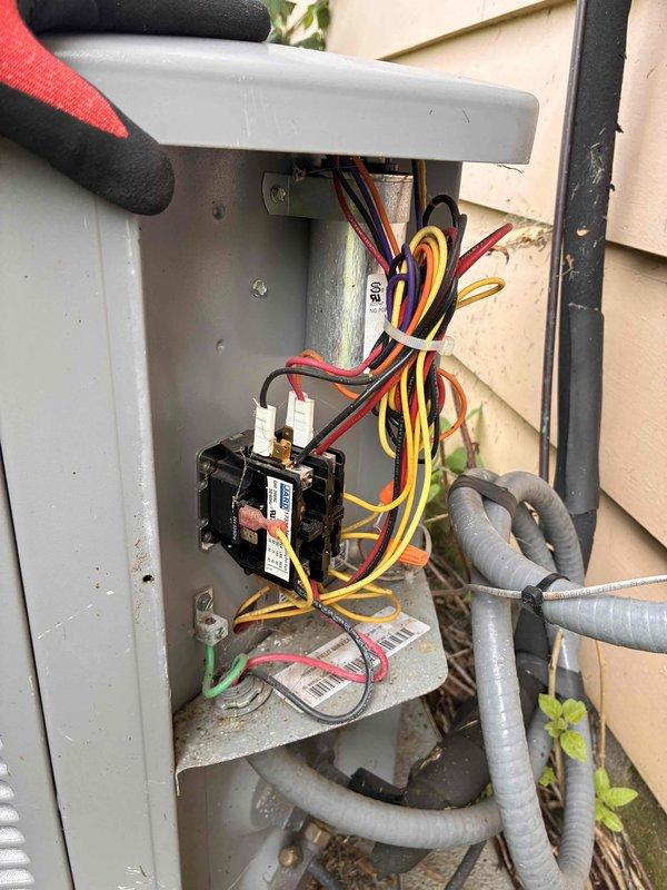 Completed preventative maintenance tune-ups on two residential air conditioning systems. Performed comprehensive system diagnostics including electrical testing with digital multimeter, verified voltage readings at 244V, inspected contactors and electrical connections within disconnect boxes, and evaluated refrigerant line integrity. All components tested within normal operating parameters and systems cleared for continued operation.