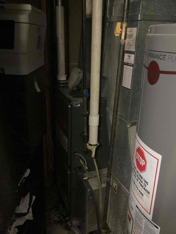 Responded to no cooling call on aging air conditioning system. Upon inspection, found failed dual run capacitor with visible corrosion and rust staining on mounting surface, preventing compressor and condenser fan motor operation. Replaced defective capacitor, verified proper electrical connections, and tested system operation with successful cooling restored.