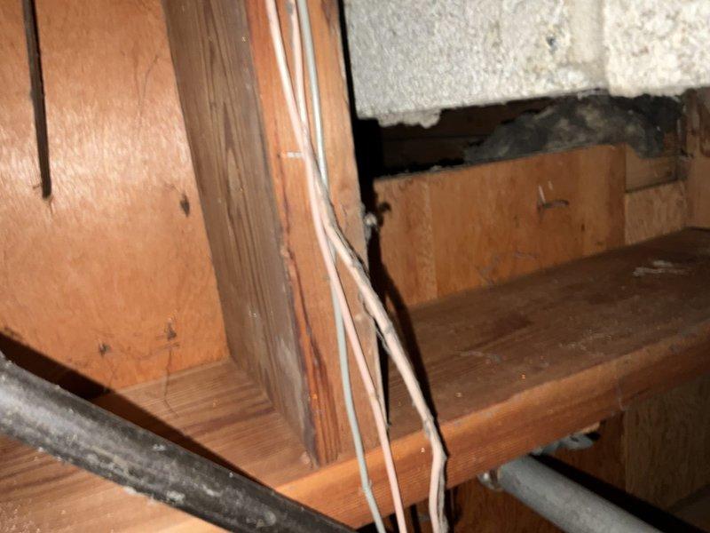 Conducted comprehensive site assessment of ranch-style home with partial finished basement to evaluate feasibility and routing for installation of bedroom return air ducts and first-floor exhaust fan system. Inspected existing ductwork infrastructure, floor joist cavities, and available pathways through basement ceiling space to determine optimal placement for new return air grilles while minimizing structural modifications. Documented current HVAC system configuration including main supply and return trunk lines, noting locations of mechanical equipment and existing utility runs that would impact new ductwork installation. Evaluated basement framing, exposed joists, and wall cavities to plan efficient routing that would accommodate proper return air flow while avoiding conflicts with existing plumbing, electrical conduit, and structural members. Assessed accessibility for installation of first-floor exhaust fan including potential mounting locations, exterior venting pathways, and ele