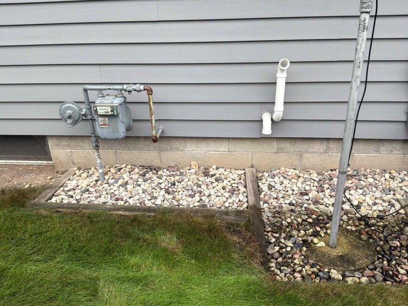 Completed electrical estimate for standby generator installation at residential property. Assessed basement area for transfer switch placement, identifying suitable location near existing electrical panel with adequate clearance from furnace and HVAC systems. Evaluated exterior mounting location adjacent to existing natural gas meter for generator pad installation, confirming gas line accessibility and proper clearances from building structure. Documented existing electrical infrastructure, utility connections, and site conditions to develop comprehensive material and labor requirements for automatic transfer switch installation and generator hookup.