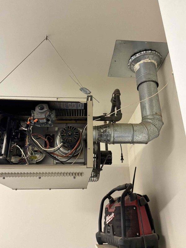 Responded to service call for non-operational garage heater requiring replacement. Upon arrival, assessed existing ceiling-mounted unit and confirmed complete system failure. Evaluated installation requirements, ductwork configuration, and electrical connections for replacement equipment. Provided comprehensive estimate for new garage heater installation, including removal of failed unit, proper sizing recommendations, and installation specifications to restore heating capability to the space.