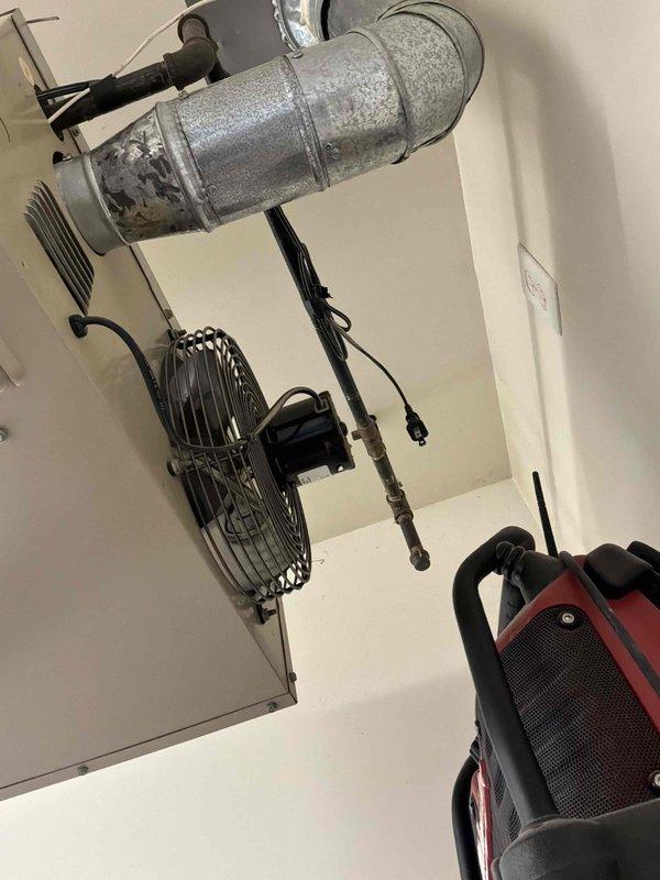 Responded to service call for non-operational garage heater requiring replacement. Upon arrival, assessed existing ceiling-mounted unit and confirmed complete system failure. Evaluated installation requirements, ductwork configuration, and electrical connections for replacement equipment. Provided comprehensive estimate for new garage heater installation, including removal of failed unit, proper sizing recommendations, and installation specifications to restore heating capability to the space.