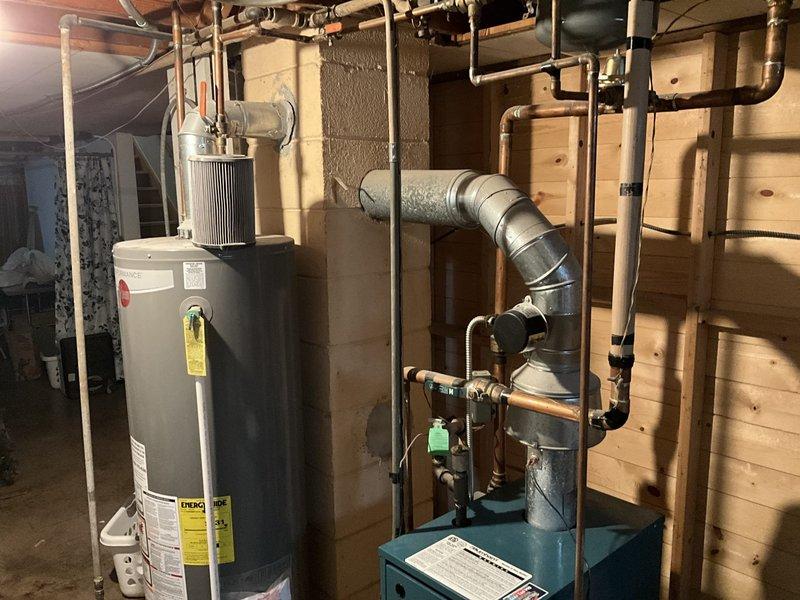Completed comprehensive estimate for replacement of existing boiler system and attic-mounted air handler unit. Assessed current equipment configuration including boiler without indirect water heating tank, documented all mechanical connections, gas piping, copper water lines, and galvanized ductwork in basement mechanical room. Evaluated attic accessibility via interior stairs for air handler replacement and provided customer with replacement options for both heating and cooling system components.