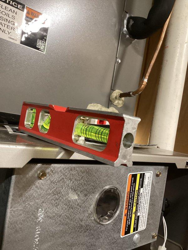 Completed comprehensive tune-up maintenance on two furnace units, performing full system diagnostics and safety inspections. Verified proper equipment leveling, tested differential pressure readings showing 35°F temperature splits, and inspected refrigerant lines and connections for integrity. Customer provided filter for unit replacement as part of scheduled preventative maintenance service.