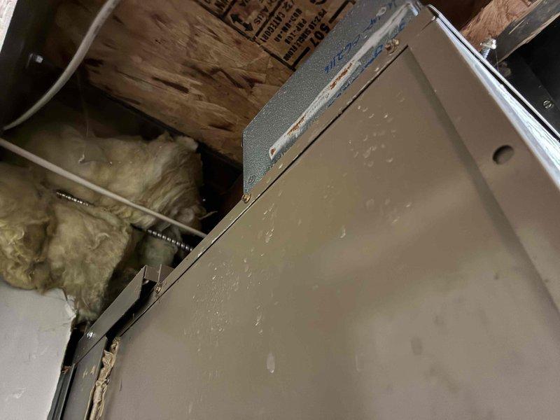 Completed on-site estimate for Magic Pak HVAC system replacement. Assessed existing unit installation in basement/crawl space area, documenting current ductwork configuration with visible condensation issues on metal duct surfaces and aging infrastructure including deteriorated wall surfaces and exposed copper piping. Evaluated structural support system, insulation conditions, and accessibility for replacement equipment installation.