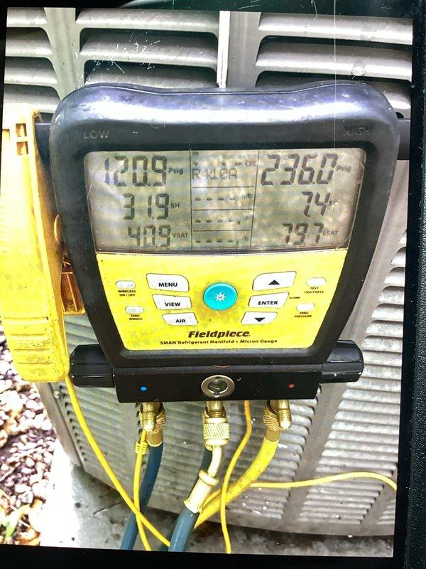 Completed prepaid maintenance cooling visit including comprehensive A/C tune-up and system performance evaluation. Connected refrigerant manifold gauges to outdoor condensing unit and recorded operating pressures and temperatures. System readings indicated 120.9 PSI suction pressure, 236.0°F discharge temperature, 31.9°F superheat, and 73.7°F subcooling. Performed clean and check procedures on air conditioning system components. Cleaned and inspected humidifier water panel as part of scheduled maintenance. All system parameters verified within acceptable operating ranges for optimal cooling performance.