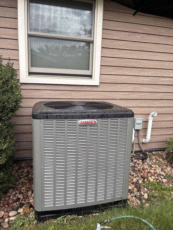 Completed scheduled cooling system maintenance visit as part of prepaid membership plan. Performed comprehensive A/C tune-up on Lennox outdoor condensing unit, including inspection of all major components, verification of proper airflow through louvered panels, and assessment of refrigerant levels. System operating efficiently with normal condensation observed on evaporator coils, indicating proper cooling function.