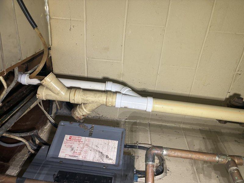 Removed existing water softener system and permanently capped supply and discharge lines. Installed proper air gap for discharge line to meet plumbing code requirements. Replaced outdated hose bib with new frost-free sillcock to allow proper hose attachment for outdoor water access.