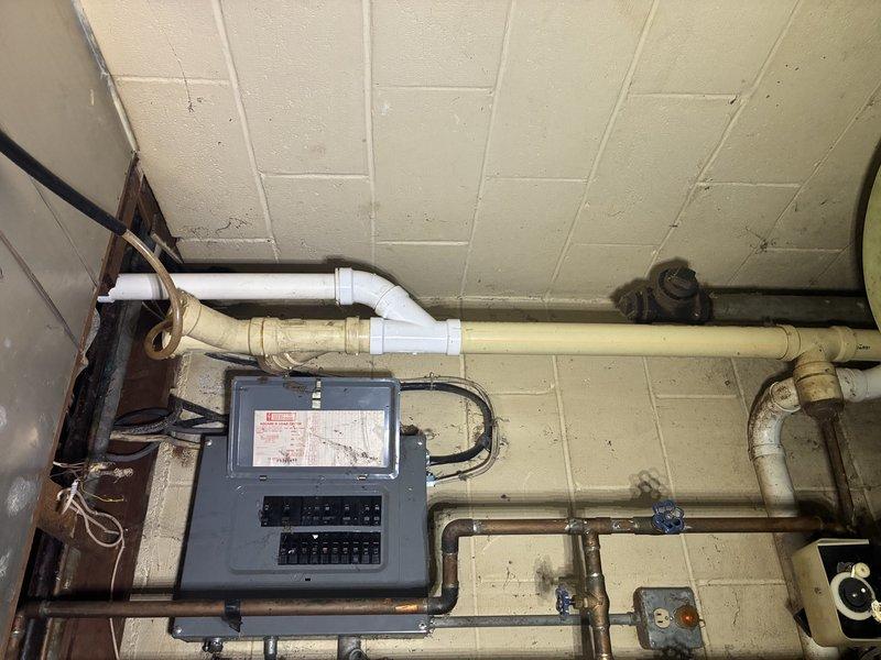 Removed existing water softener system and permanently capped supply and discharge lines. Installed proper air gap for discharge line to meet plumbing code requirements. Replaced outdated hose bib with new frost-free sillcock to allow proper hose attachment for outdoor water access.