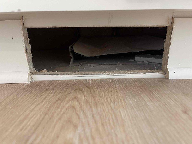 Returned to installation site to address register placement. Documented floor register opening dimensions and cavity conditions for proper register fitting. Measured opening to ensure correct register size selection and verified ductwork accessibility for secure installation.