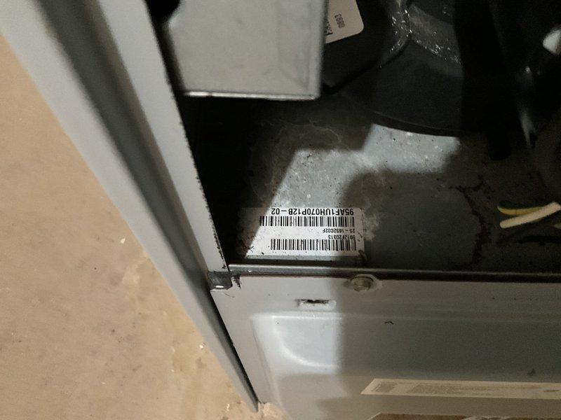 Provided estimate for converting existing dual HVAC system configuration to a single unified system with multilevel zoning controls and installation of whole home humidification equipment. Both existing furnaces are currently located in basement area. Documented existing outdoor condensing unit and interior equipment with serial number documentation for replacement specifications.