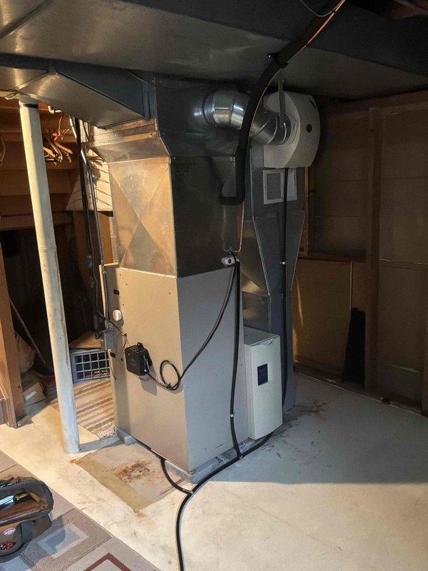 Conducted on-site assessment of existing residential natural gas furnace system for replacement estimate. Evaluated current Lennox furnace installation in basement utility room, including associated air handler, ductwork configuration, PVC venting system, and condensate drain lines. Documented equipment specifications, existing infrastructure, and spatial requirements through photographic documentation to provide accurate replacement proposal for new natural gas furnace system.