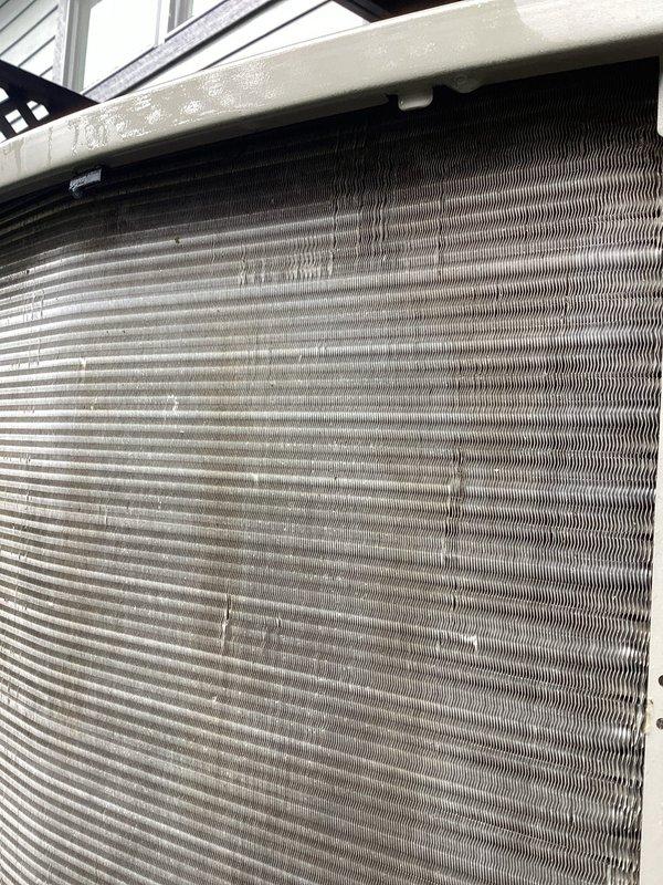 Completed furnace tune-up maintenance and replaced #35 water panel humidifier pad. Inspected air conditioning evaporator coil and performed coil rinsing to remove accumulated dust and debris between fins. All HVAC system components operating properly following maintenance completion.