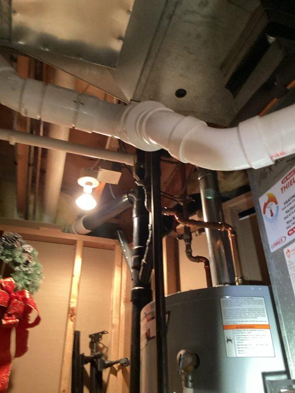 Completed furnace tune-up maintenance and replaced #35 water panel humidifier pad. Inspected air conditioning evaporator coil and performed coil rinsing to remove accumulated dust and debris between fins. All HVAC system components operating properly following maintenance completion.
