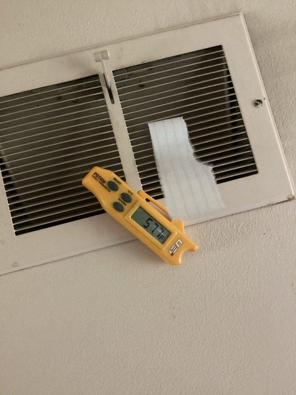 Responded to service call for furnace that would not shut off and was unable to reach setpoint temperature. Upon arrival, performed diagnostic testing using digital thermometer to measure supply air temperature at register, which read 75.2°F, indicating insufficient heat output. Verified system operation and temperature readings to identify cause of continuous run cycle and inadequate heating performance. Documented findings with temperature measurements at both the unit and supply vent locations for service records.
