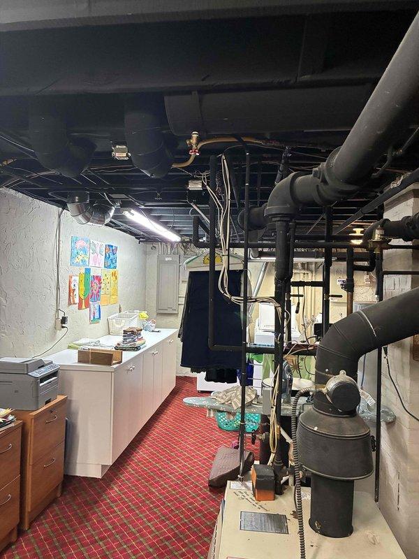 Responded to service call for second opinion on reported boiler leak. Upon arrival, performed comprehensive inspection of boiler system and associated components including piping, valves, and connections. Evaluated all visible plumbing connections, pressure relief valve, circulator pump, and heat exchanger for signs of active leakage or moisture accumulation. Documented findings with photographic evidence of equipment condition and mechanical room layout for customer records and further assessment.