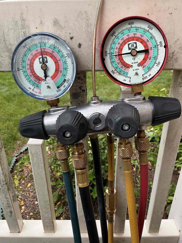 Completed annual AC tune-up on 8-year-old cooling system with no reported issues. Performed comprehensive inspection of outdoor condenser unit, verified proper refrigerant pressures using manifold gauges, checked electrical connections and conduit, and confirmed system operation. All components functioning within normal parameters; 2-year-old furnace and thermostat also operating properly with no service required at this time.