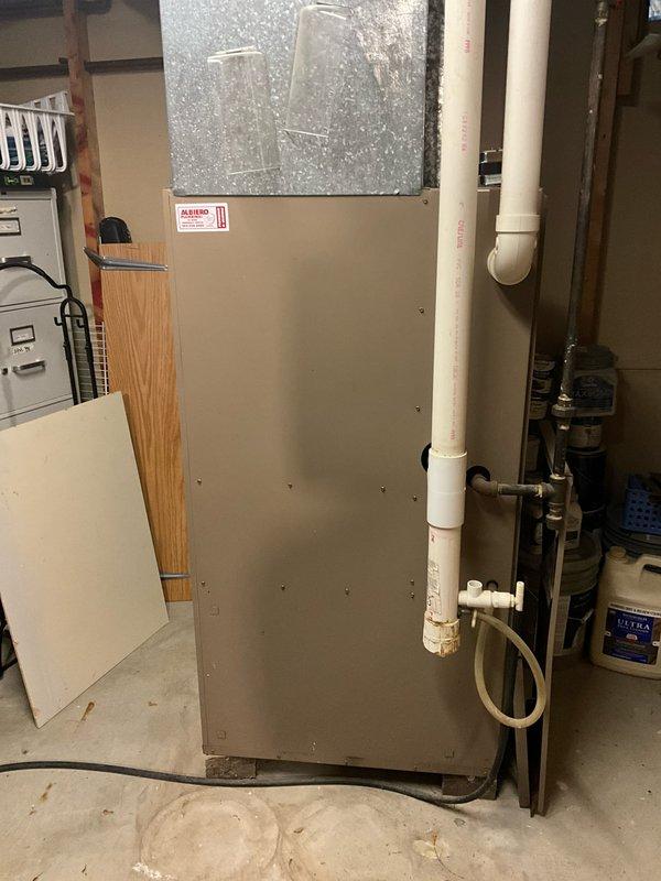 Conducted on-site evaluation of non-operational natural gas furnace located in basement. Home contains two separate furnace systems; inspected failed unit that has been inoperative for approximately one year. Assessed existing installation including ductwork connections, venting system with PVC piping, and current equipment configuration. Provided comprehensive replacement estimate for new natural gas furnace system to restore heating functionality to affected zone of residence.