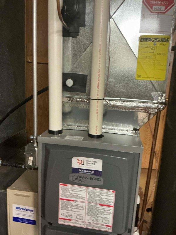 Performed comprehensive tune-up on residential Armstrong Air furnace and Nutone air conditioning system. Conducted visual inspection of both units, verified proper installation and component condition, tested refrigerant pressures using manifold gauges, and confirmed all safety labels and specifications were intact. Both indoor and outdoor units showed no signs of deterioration and were operating within normal parameters.