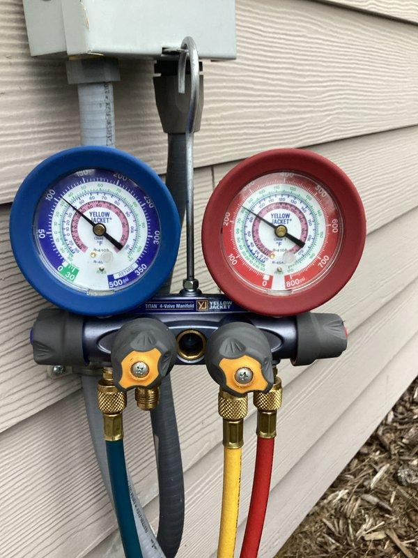 Completed comprehensive furnace and air conditioning tune-up service at residential property. Connected manifold gauge set to outdoor condensing unit to verify refrigerant pressures and system performance, confirming proper operation of cooling system. Performed standard maintenance procedures on both heating and cooling equipment to ensure optimal efficiency and reliability for the upcoming season.