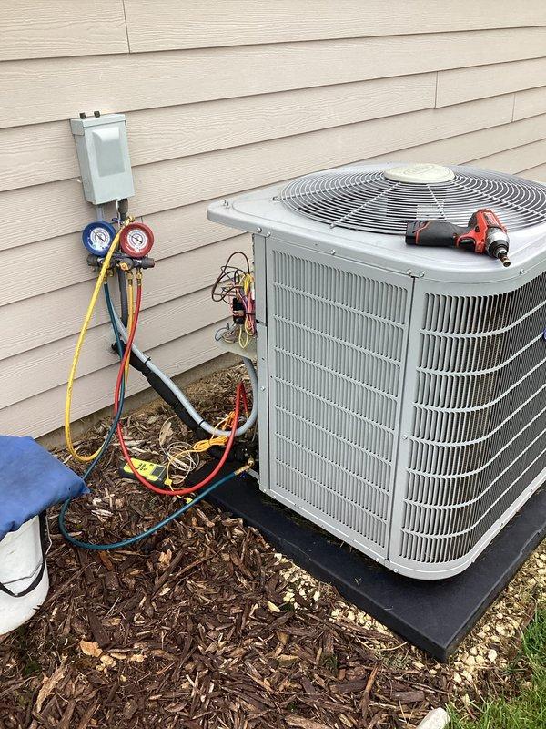 Completed comprehensive furnace and air conditioning tune-up service at residential property. Connected manifold gauge set to outdoor condensing unit to verify refrigerant pressures and system performance, confirming proper operation of cooling system. Performed standard maintenance procedures on both heating and cooling equipment to ensure optimal efficiency and reliability for the upcoming season.