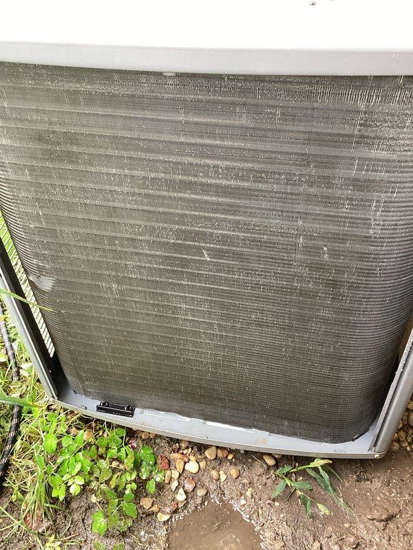 Performed routine maintenance on outdoor AC condensing unit. Inspected electrical disconnect box, verified capacitor condition and all wire connections secure. Noted heavy dirt and debris accumulation on condenser coil fins, which was reducing system efficiency and airflow. Cleaned condenser coils to restore proper heat transfer and optimal unit performance.