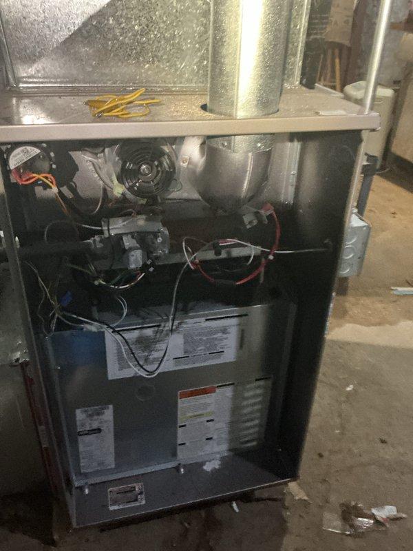 Performed comprehensive inspection of two residential furnaces following a reported power surge event. Conducted visual examination of internal components including blower motor assemblies, control boards, electrical connections, and wiring integrity. Verified proper operation of both heating units, checked all safety controls, and confirmed systems were functioning correctly with no apparent surge damage. All electrical connections were secure and control boards showed no signs of failure or malfunction.