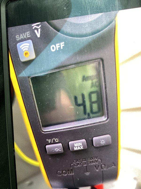Responded to callback for newly installed AC unit making loud squealing noise. Upon arrival, inspected outdoor condenser unit and identified condenser fan motor bearing issue causing the noise. Measured system amperage at 48 amps to verify proper electrical operation. Lubricated fan motor bearings and verified noise was eliminated. Unit operating normally with proper airflow through condenser coils upon departure.