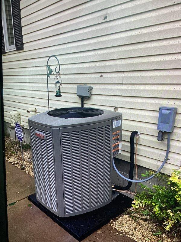 Responded to callback for newly installed AC unit making loud squealing noise. Upon arrival, inspected outdoor condenser unit and identified condenser fan motor bearing issue causing the noise. Measured system amperage at 48 amps to verify proper electrical operation. Lubricated fan motor bearings and verified noise was eliminated. Unit operating normally with proper airflow through condenser coils upon departure.