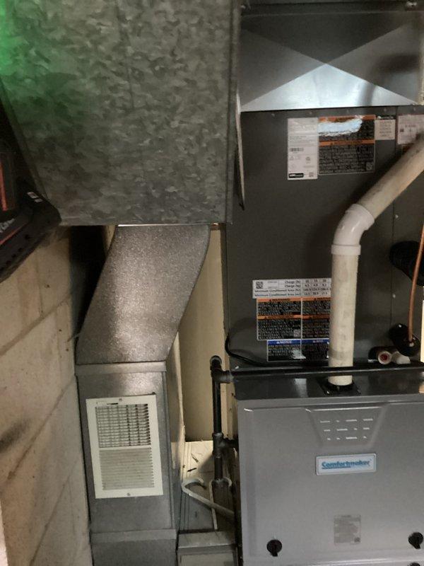 # HVAC Installation Summary

Successfully completed a full residential air conditioning system and evaporator coil installation in basement utility area. Installed new air handler unit with integrated evaporator coil, establishing proper refrigerant line connections using insulated copper tubing. Configured complete ductwork integration including flexible and rigid metal transitions, ensuring proper airflow distribution throughout the system.

# Detailed Work Performed

Installed complete air conditioning system including new air handler unit and evaporator coil assembly in residential basement location. Positioned and secured main air handler unit with proper clearances for service access and operational efficiency. Mounted evaporator coil within air handler cabinet, establishing refrigerant circuit connections.

Ran and insulated copper refrigerant lines from indoor unit to outdoor condensing unit location, ensuring proper sizing and routing per manufacturer specifications. Installed