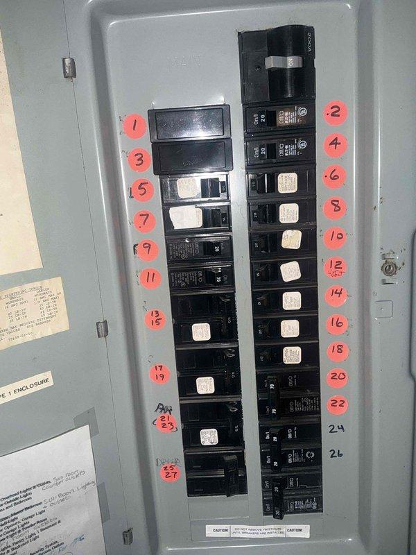 Responded to emergency service call for 21-year-old air conditioning system requiring replacement estimate. Evaluated existing natural gas furnace in basement, which was previously installed by our company within the last 10 years and remains in good operating condition. Documented electrical panel configuration and circuit breaker layout, photographing the 200-amp main service panel with numbered circuit identification system to assess compatibility requirements for new AC equipment installation. Provided comprehensive replacement estimate for aging air conditioning unit while confirming furnace system does not require replacement at this time.