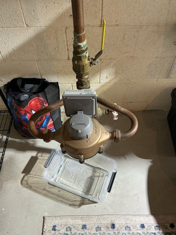 Responded to water main leak in basement utility area. Conducted thorough inspection of copper pipe assembly and brass valve system connected to water meter. Documented precise measurements of existing piping configuration to determine correct replacement parts needed. Assessed condition of corroded brass fittings and aging copper pipes showing significant patina and wear. Prepared specifications for parts ordering and developed comprehensive repair estimate for water main leak remediation.