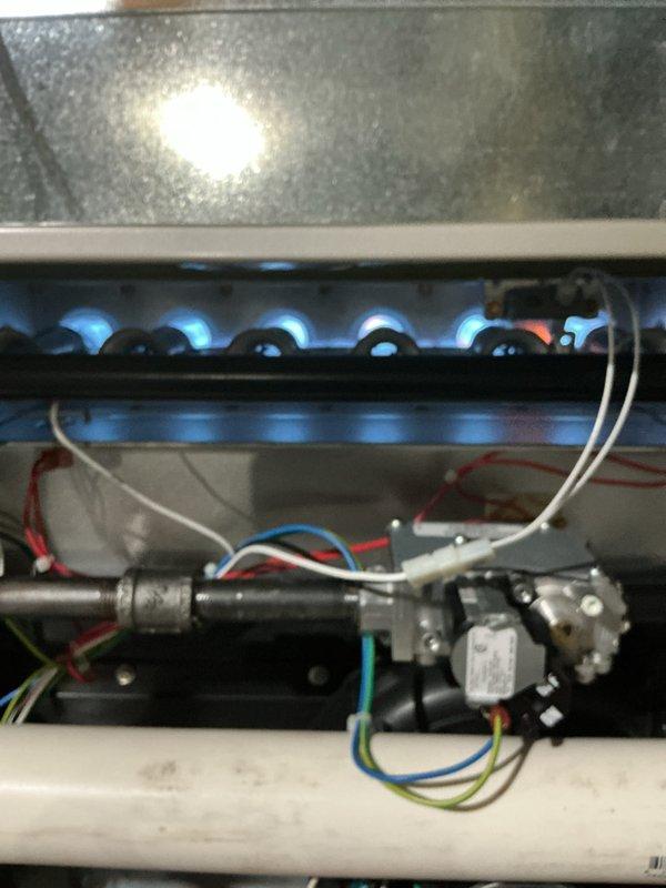 Completed comprehensive tune-up service on commercial furnace and air conditioning system, including installation of 16x25x4 air filter. Performed full system inspection with burner operation verification showing proper blue flame combustion pattern and confirmed all electrical connections, gas valve operation, and thermostat functionality were within normal parameters.