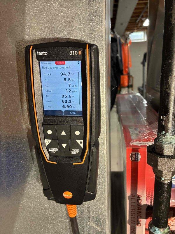 Performed comprehensive furnace tune-up and combustion analysis using Testo 310 II flue gas analyzer, recording stack temperature of 94.7°F, oxygen level of 8.6%, and carbon monoxide readings of 7 ppm undiluted and 12 ppm air-free, all within acceptable parameters. Verified gas pressure at 53 units using digital manometer to ensure proper fuel delivery and system efficiency. All combustion safety checks passed, and unit is operating within manufacturer specifications.