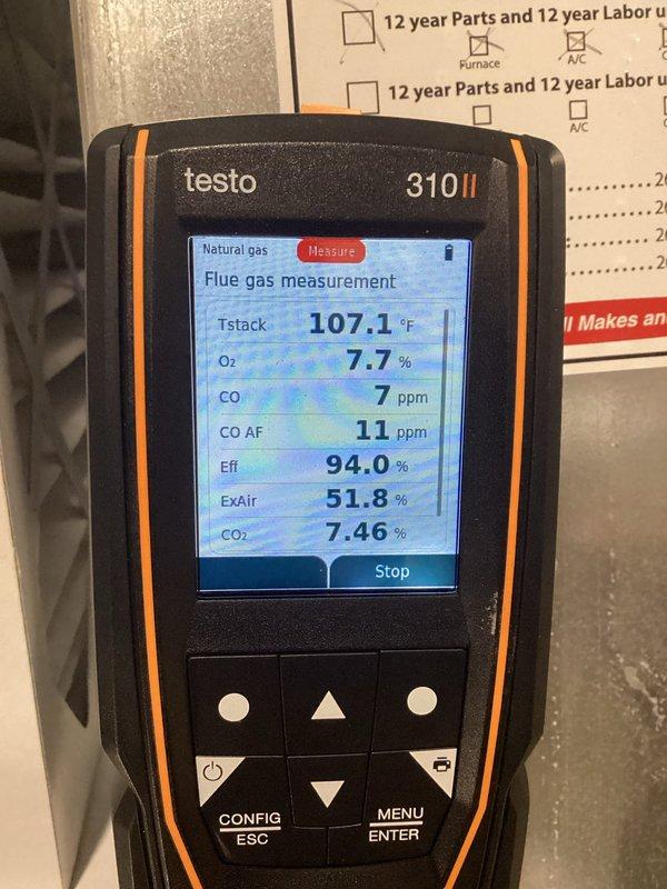 Completed annual tune-up and maintenance on air conditioning system and natural gas furnace. Performed combustion analysis on heating unit with flue gas analyzer, confirming optimal efficiency at 94.0% with safe carbon monoxide levels of 7 ppm and proper oxygen content at 7.7%. Inspected condensate drain pan and PVC drain lines, verified proper installation and drainage flow, confirmed all components clean and functioning correctly.