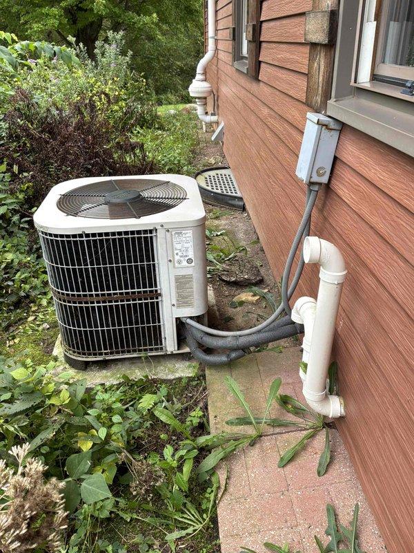 Provided comprehensive estimate for complete air conditioning system replacement on 22-year-old unit currently operating but nearing end of service life. Evaluated existing outdoor condenser unit and indoor furnace configuration in basement to determine appropriate replacement specifications and installation requirements for proactive system upgrade prior to potential failure.