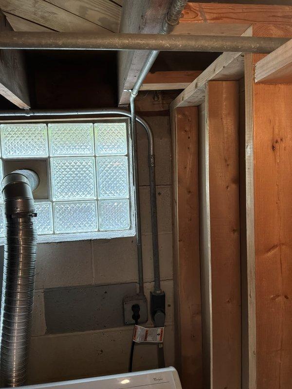 Completed installation of new gas line for dryer in basement laundry area. Replaced existing copper piping with steel piping to meet code requirements and ensure safe gas delivery to appliance. Routed flexible gas connector from supply line to dryer location, securing all connections and verifying proper operation of the system.