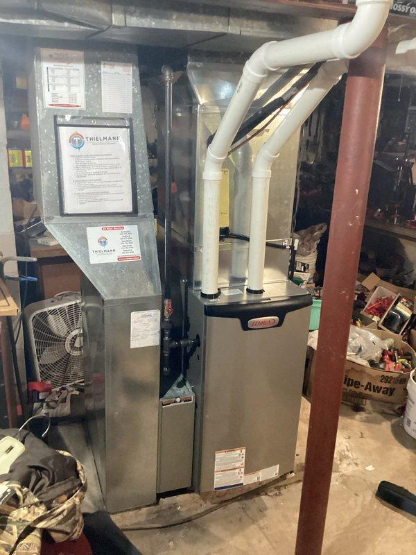Completed installation of new Lennox furnace system in basement utility area. Work included proper positioning and mounting of furnace unit, installation of white PVC venting pipes for exhaust and intake, connection to existing ductwork system, and integration with electrical control panel. All installations performed in accordance with manufacturer specifications and local building code requirements with proper permits obtained. Electrical work completed by licensed electrician to ensure safe operation and code compliance.