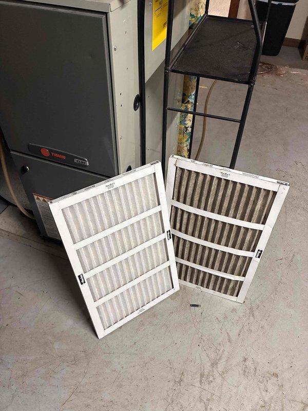 Completed comprehensive tune-up service on commercial Trane HVAC system, including both furnace and air conditioning units. Replaced heavily contaminated 16x25x1 air filter with new unit, as evidenced by significant dust and debris accumulation on the removed filter. Performed standard maintenance inspection of all system components, noting corrosion present on flame sensor rod that will require monitoring for future replacement.