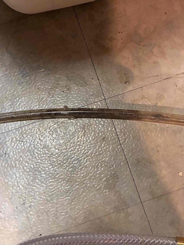 Responded to service call for reported leak at furnace. Upon inspection, identified leaking gas line connection at furnace inlet. Removed and inspected brass hexagonal pipe fitting, which showed significant wear, oxidation, and deteriorated thread sealant. Replaced faulty fitting with new brass connector, applied appropriate thread sealant, and torqued to manufacturer specifications. Performed leak test using soap solution to verify repair integrity. Placed protective insulation material in work area during repair. System tested and confirmed no further leaks present at furnace connections.