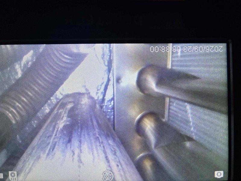 Completed comprehensive tune-up maintenance on HVAC system greater than 10 tons. Performed internal ductwork inspection using borescope camera to assess interior condition of metallic duct surfaces and verified proper airflow pathways. Inspected condensate drain system including PVC piping and elbow connections in mechanical room, confirmed proper drainage operation and cleared any potential blockages.
