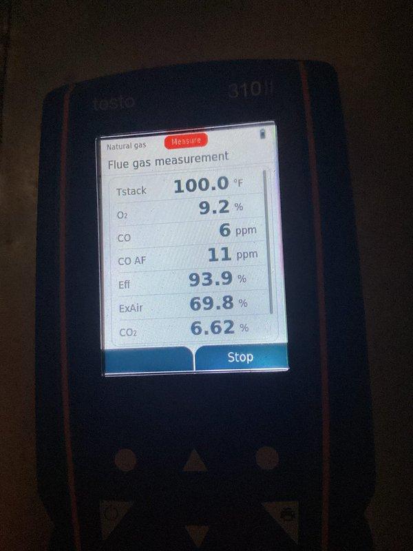 Completed furnace tune-up on natural gas heating system. Performed combustion analysis revealing optimal efficiency at 93.9% with safe CO levels at 6 ppm in flue and 11 ppm ambient, stack temperature reading 100°F, and proper oxygen levels at 9.2%. Noted moderate debris accumulation in unit base requiring cleaning during maintenance visit.
